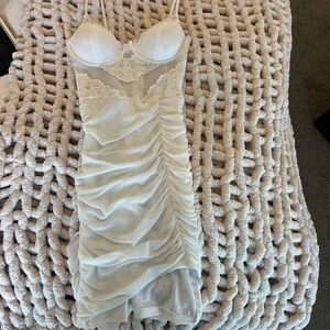 White bodycon dress with lace details